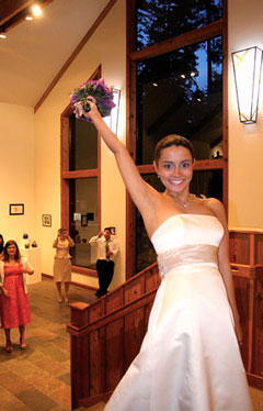 Tossing the bouquet in the Foyer; photo by Ron Bolander