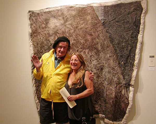 Gualala Salon second place winner Suzan Friedland (right) and judge Ira Yeager (left) with Friedland's winning piece 'Inflaton Field'