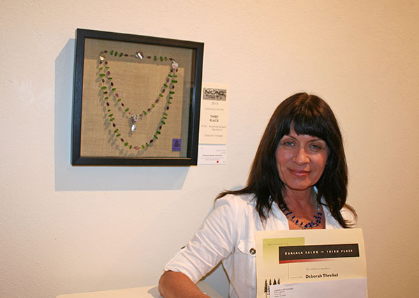 Gualala Salon third place winner Deborah Threlkel with her winning piece 'Abalone Queen Necklace'